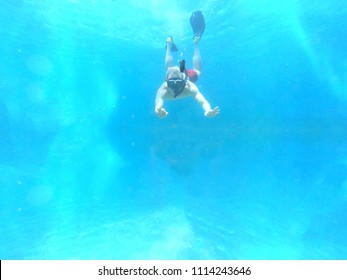 Caucasian Man Snorkling In The Ocean