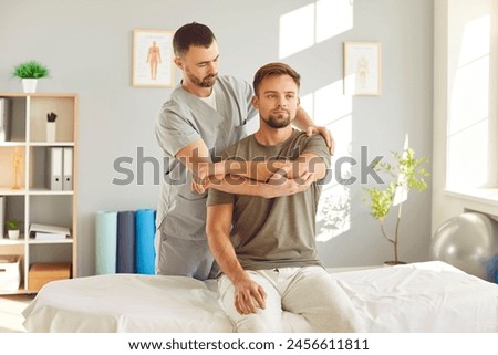 Image, Stock Photo A physiotherapist performs a facial acupuncture session on her patient to tone the muscles of the face