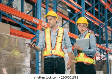 Caucasian Man, Woman Warehouse Supervisor Wear Safety Discuss,talk And Use Clipboard Check Box Package On Shelf, Product Distribution Inventory Management,Logistics Shipping Business Planning Industry