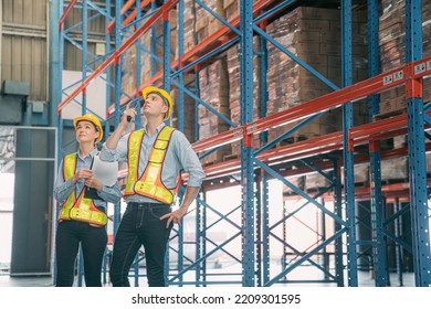 Caucasian Man, Woman Warehouse Supervisor Wear Safety Discuss,talk And Use Clipboard Check Box Package On Shelf, Product Distribution Inventory Management,Logistics Shipping Business Planning Industry