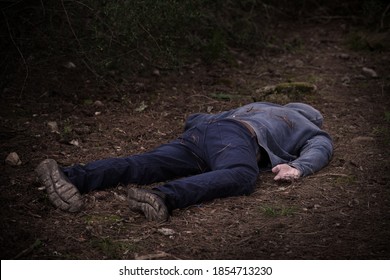 A caucasian man's dead body was found in the park. Murder in the woods. Murdered citizen. Crime scene - Shutterstock ID 1854713230