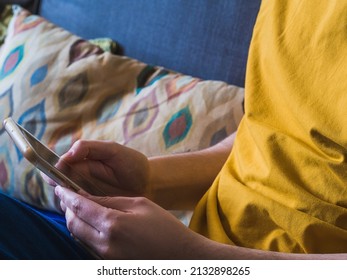 Caucasian man's hands scrolling with the smartphone. Socialmedia concept
