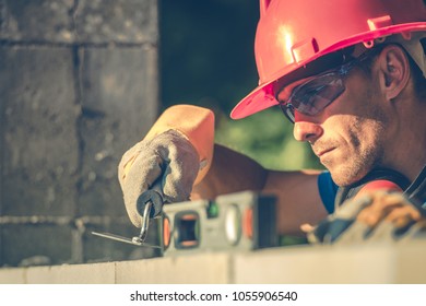 Caucasian Masonry Worker In Hard Hat. Construction Site Theme.