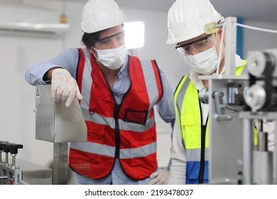 Caucasian Mechanic Technician Maintenance, Repairing Industrial Machinery Equipment In Factory. Professional Worker In Protective Clothing With Goggles And Mask Using Wrench At Manufacturing Factory