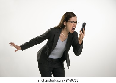 Caucasian Mid Adult Professional Business Woman Yelling Into Cell Phone In Anger.