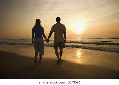 Similar Images, Stock Photos & Vectors of Back view of mid-adult couple ...