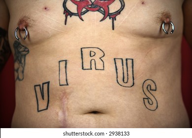 Caucasian Mid-adult Man Midriff With Tattoos And Piercings.