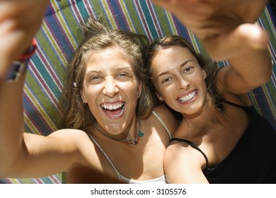 Caucasian Mid-adult Women Being Silly In Hammock.