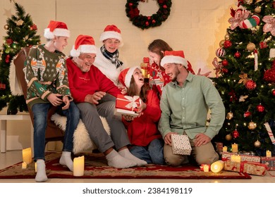 caucasian people big family celebrating christmas party in living room at home, kid girl grandchild open gift box surprise from parent celebrate festive holiday X-mas eve together in house - Powered by Shutterstock