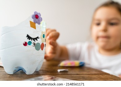 Caucasian Preschool Girl Doing Crafts With Plastic Bottle And Paints. Recycle Upcycling Waste. Sustainable Lifestyle