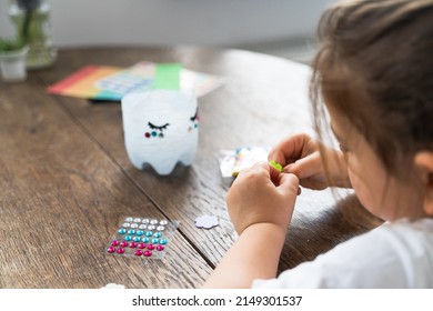 Caucasian Preschool Girl Doing Crafts With Plastic Bottle And Paints. Recycle Upcycling Waste. Sustainable Lifestyle