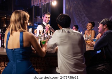 Caucasian profession bartender making a cocktail for customer at a bar. Attractive man pouring mixes liquor ingredients cocktail drink from cocktail shaker into the glass at night club restaurant. - Powered by Shutterstock