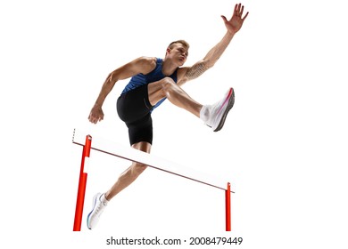 Caucasian Professional Male Athlete Jumping Over The Barrier Isolated On White Background. Running With Obstacles Concept. Muscular Man. Action, Motion, Healthy, Sport And Lifestyle. Copyspace For Ad.
