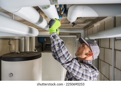 Caucasian Professional Plumbing Contractor in His 40s Finishing Sanitary Pipeline Installation. - Shutterstock ID 2250690253