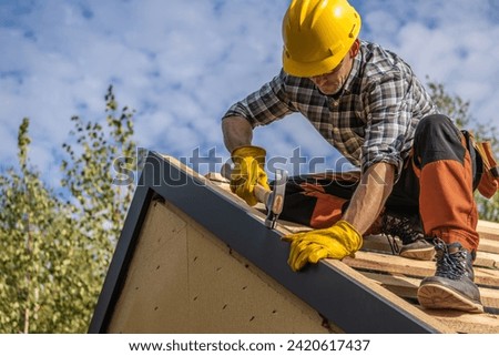 Caucasian Professional Roof Contractor and His Job. Roofing Theme.