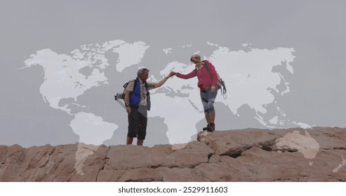 Caucasian senior couple hiking holding hands on cliff, over moving world map. active outdoor lifestyle, healthy retirement, travel and global communication concept, digitally generated image. - Powered by Shutterstock