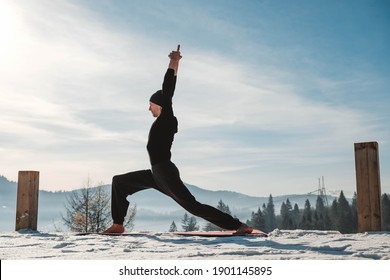 Caucasian senior man doing yoga exercises in front of amazing sunset on the winter mountains. Copy, empty space for text. - Powered by Shutterstock