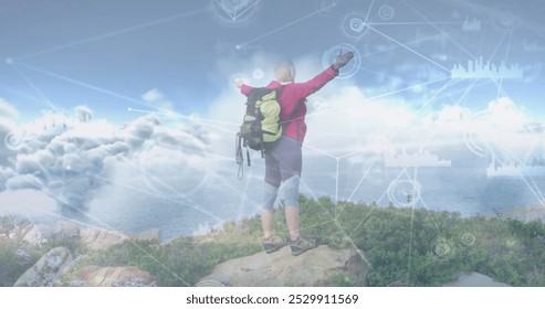 Caucasian senior man hiking in countryside on hill with arms raised, over network of connections. active lifestyle, healthy retirement and global communication concept, digitally generated image. - Powered by Shutterstock