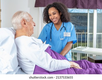 Caucasian senior smiling with doctor at the hospital. Retired elderly people living their life at its best - Shutterstock ID 2137533655