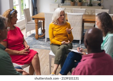 Caucasian Senior Woman Talking With Multiracial People At Group Therapy Session. Unaltered, Support, Alternative Therapy, Community Outreach, Mental Wellbeing And Social Gathering.