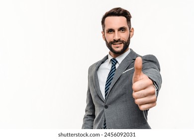 Caucasian smiley man in formal tuxedo showing thumb up in camera isolated over grey background. Successful confident banker manager businessman approving with gesture - Powered by Shutterstock