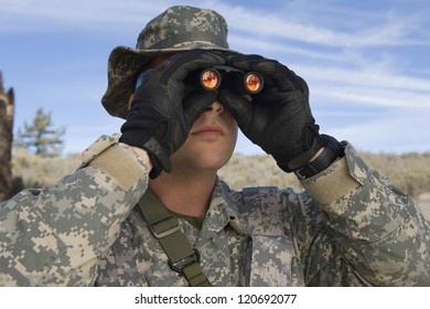 Caucasian Solider Looking Through Binoculars