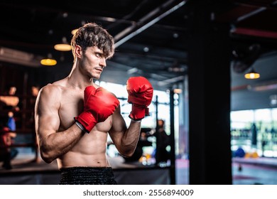 Caucasian sportsman wearing exercise wrapping glove on hand at stadium. Active fitness trainer or athlete bodybuilder male working out, training exercise to maintain muscle for health care at gym. - Powered by Shutterstock