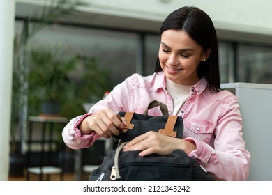 Caucasian Student Woman Closed Her Backpack While Preparing To The Lesson At The Library. High School Concept. Stock Photo