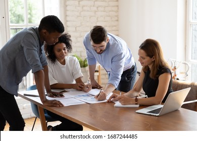 Caucasian Team Leader Share Project Idea To Multi-ethnic Workmates, Workgroup Brainstorming Discussing Planning Corporate Strategy, Doing Paperwork, Reviewing Financial Data At Office Meeting Concept