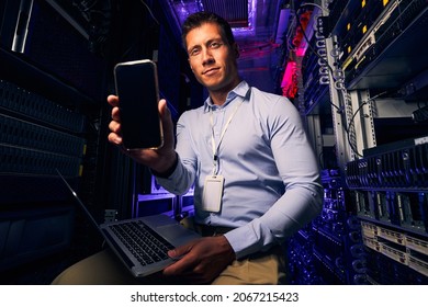 Caucasian IT Technician Working In Server Room