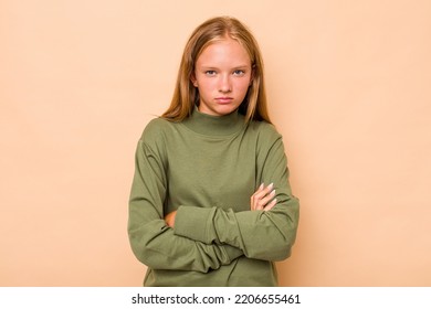 Caucasian Teen Girl Isolated On Beige Background Unhappy Looking In Camera With Sarcastic Expression.