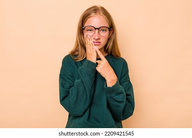 Caucasian Teen Girl Isolated On Beige Background Having A Strong Teeth Pain, Molar Ache.