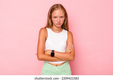 Caucasian Teen Girl Isolated On Pink Background Unhappy Looking In Camera With Sarcastic Expression.