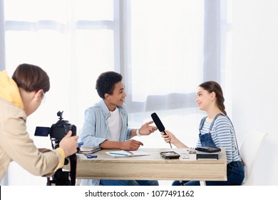 Caucasian Teen Kid Conducting Interview With African American Friend For Video Blog