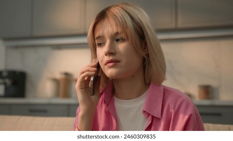 Caucasian teen student girl woman lady female homeowner renter at home apartment indoors talking mobile phone call smartphone conversation confused puzzled sad discuss insurance mortgage loan problem - Powered by Shutterstock