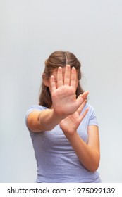 Caucasian Teenager Girl Making Stop Gesture On White Background. Childhood Problem, Voice Concept, Discrimination Or School Abuse.