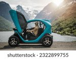 Caucasian Tourist Exploring Vestland County Near Stryn, Norway by Driving Small Electric Vehicle. Glacier Overlook.