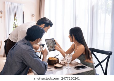 Caucasian waiter receiving order serving from customer in restaurant. Attractive server service man working, taking note, writing order from consumer with pen at table in dining room with happiness. - Powered by Shutterstock