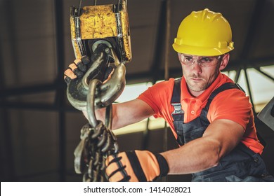 Caucasian Warehouse Lift Operator In His 30s. Heavy Duty Lifting Equipment.