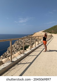 Caucasian White Blond Woman Hiking In Wied Fulija, Zurriq Area In Malta On Sunny Hot September Day. Wied Fulija - New Recreation Zone In Malta