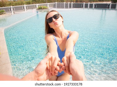 Caucasian White Men And Women Happy At Swimming Pool. Pov Couple Holding Hands Woman Leading The Way To Private Pool Villa