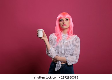 Caucasian Woman Doing Eye Roll Gesture And Holding Cup Of Coffee, Feeling Displeased And Indifferent In Front Of Camera. Having Annoyed Attitude And Feeling Discontent, Uninterested.