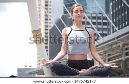 Similar – Young, tall woman sits in a summer dress on the beach of the Baltic Sea and smiles