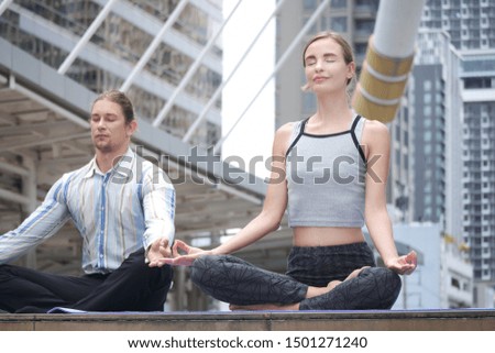 Similar – Young, tall woman sits in a summer dress on the beach of the Baltic Sea and smiles