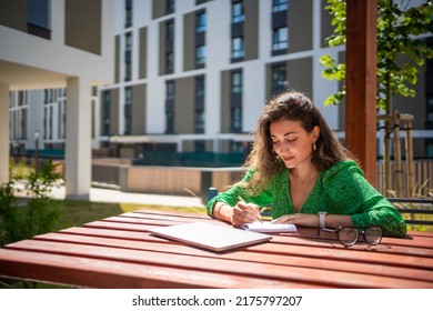 Caucasian woman drawing ideas notebook outside office  High quality photo