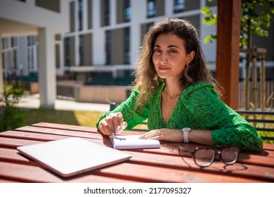 Caucasian woman drawing ideas notebook outside office  High quality photo