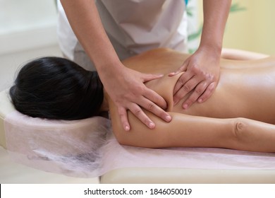 Caucasian woman getting a back massage in the spa salon. Body care concept. - Shutterstock ID 1846050019