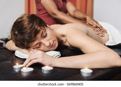 Caucasian Woman Having Ayurveda Treatment In India. Kerala. Oil Body Massage, Asian Spa And Healthcare Concept.