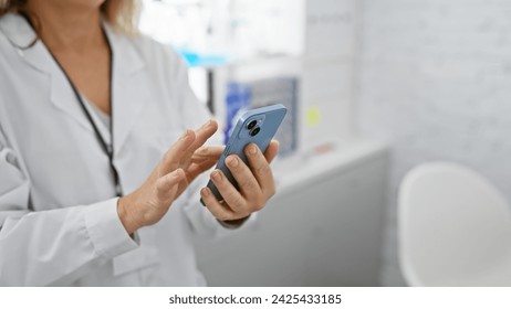 Caucasian woman healthcare professional using smartphone in laboratory setting