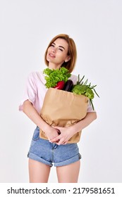 Caucasian Woman Hold Paper Bag With Vegetables